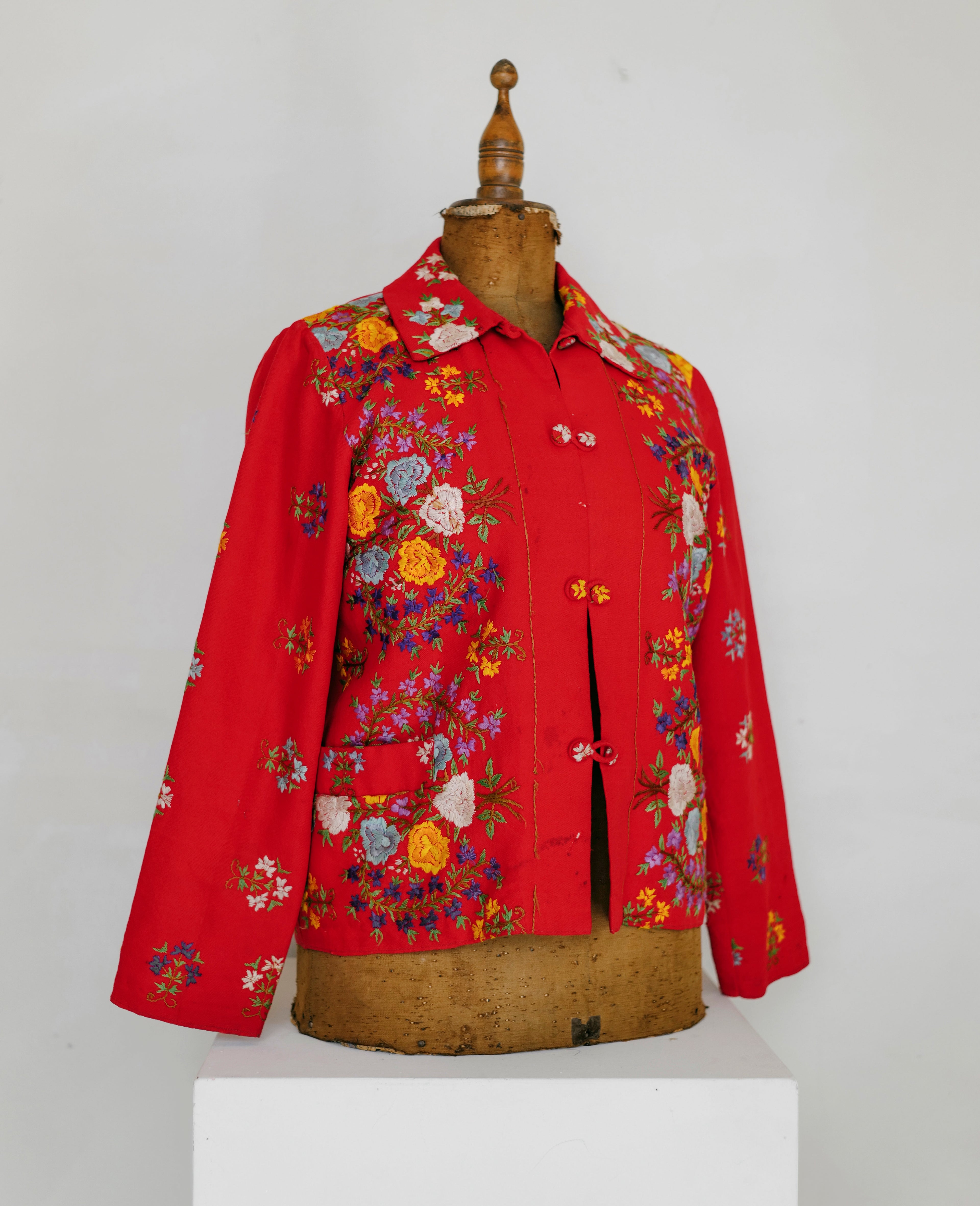Vintage red wool Jacket with floral embroidery.