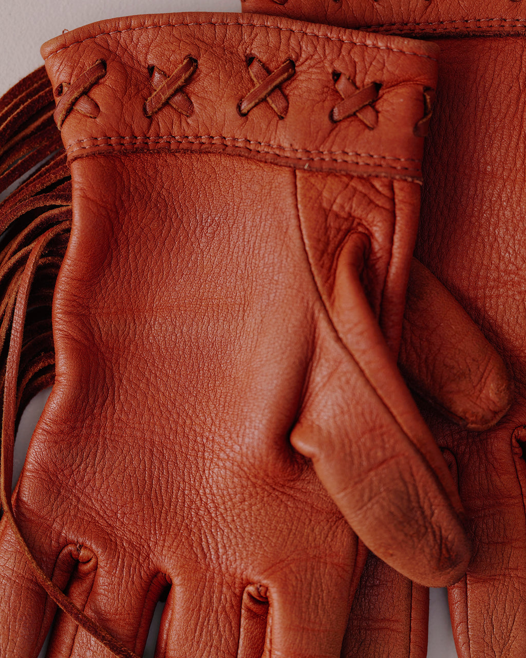 Leather fringe gloves